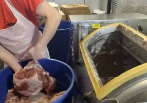 adding meat to a Lance meat tumbler